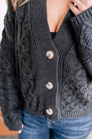 Legendary Cable Knit Cardigan In Charcoal